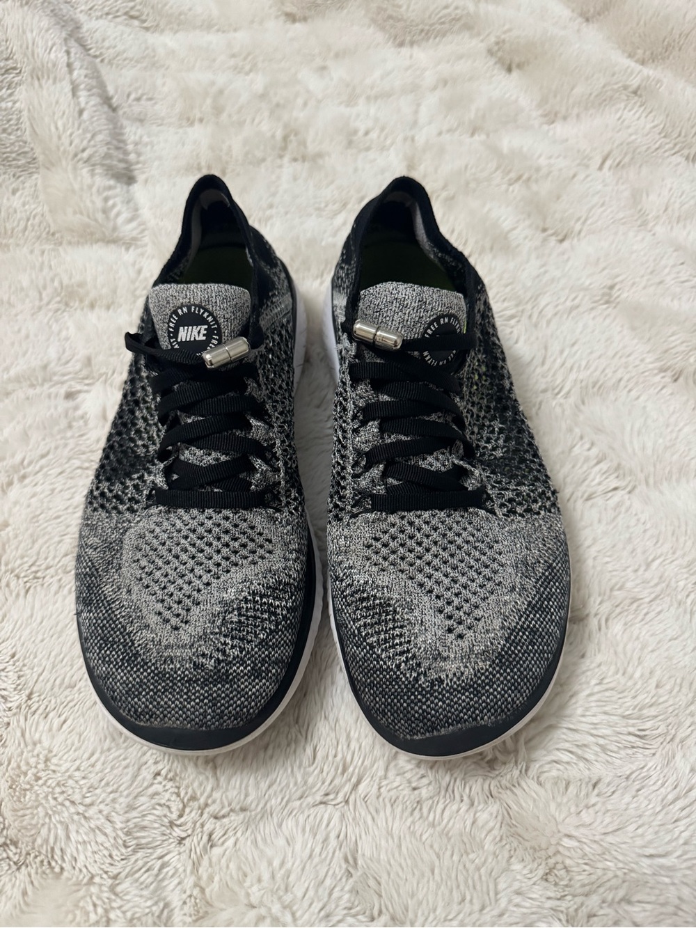 Nike Flyknit Low-Top Women’s Sneakers in Black and Gray